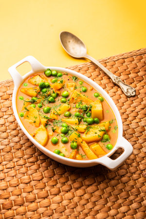 Aloo mutter is a Punjabi dish from the Indian subcontinent which is made from potatoes and peas in a spiced creamy tomato based sauceの写真素材