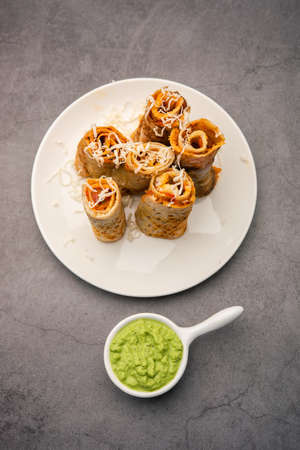 Gini or Jini Dosa is a mumbai style street food variety served in a plate with green chutney
