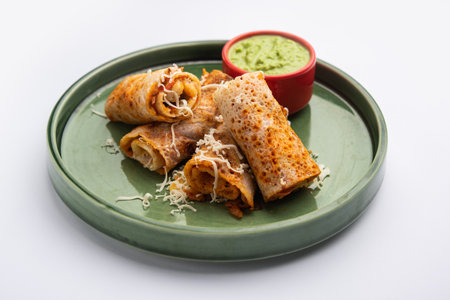 Gini or Jini Dosa is a mumbai style street food variety served in a plate with green chutney