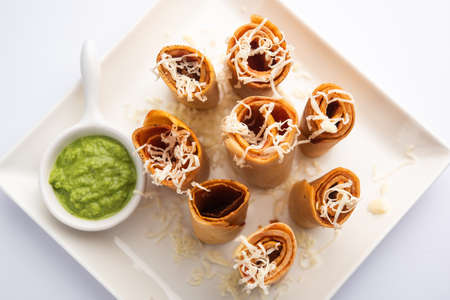 Gini or Jini Dosa is a mumbai style street food variety served in a plate with green chutney