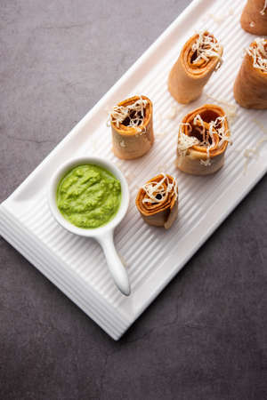 Gini or Jini Dosa is a mumbai style street food variety served in a plate with green chutney