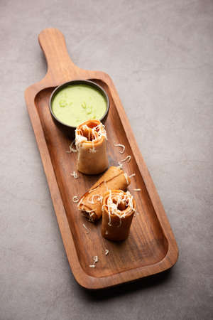 Gini or Jini Dosa is a mumbai style street food variety served in a plate with green chutney