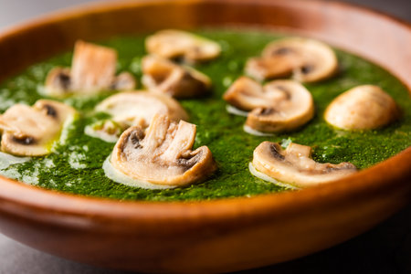 Palak Mushroom is a healthy and delicious dish of sauteed button mushrooms and aromatics in a creamy spinach sauceの写真素材