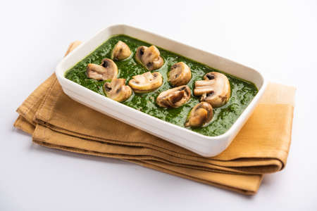 Palak Mushroom is a healthy and delicious dish of sauteed button mushrooms and aromatics in a creamy...