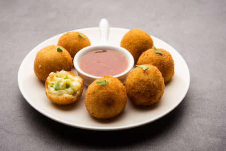 jalapeno cheese balls or poppers served with tomato ketchup