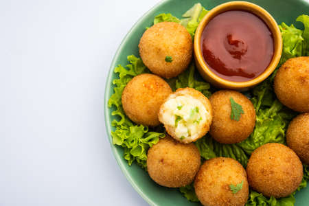 jalapeno cheese balls or poppers served with tomato ketchup
