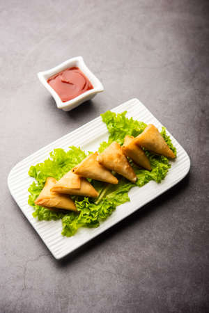 cocktail mini triangle samosa made using patti or strip, popular home made snack from India