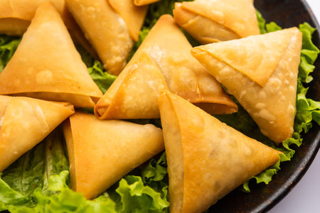 cocktail mini triangle samosa made using patti or strip, popular home made snack from Indiaの写真素材