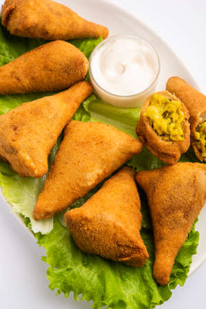 Bread samosa is a variation of regular samosa with same potato peas filling using sandwich bread...