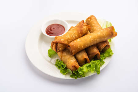 Roll shaped Cigar Samosa are the perfect finger food served with ketchup