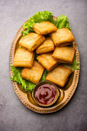 Vegetable Chinese samosa is a square shape a deep-fried snack prepared with homemade pastry sheets...