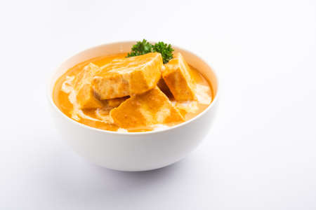 Paneer Butter Masala or Cheese Cottage Curry is a rich & creamy curry made with paneer, spices, onions, tomatoes, cashews and butterの写真素材