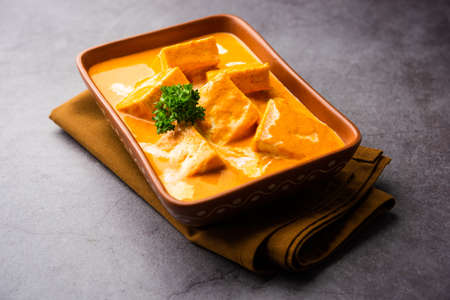 Paneer Butter Masala or Cheese Cottage Curry is a rich & creamy curry made with paneer, spices, onions, tomatoes, cashews and butterの写真素材