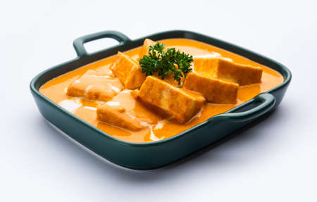 Paneer Butter Masala or Cheese Cottage Curry is a rich & creamy curry made with paneer, spices, onions, tomatoes, cashews and butterの写真素材