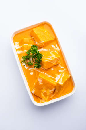 Paneer Butter Masala or Cheese Cottage Curry is a rich & creamy curry made with paneer, spices, onions, tomatoes, cashews and butterの写真素材