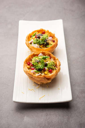 Aloo Tokri Chaat or Potato Basket stuffed chat or katori chatの写真素材