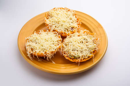 chaat basket or basket chaat is stuffed with potatos and spices with different chutneys topped with...