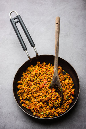 Egg bhurji, also known as Masala Anda Bhurji, is a scrambled eggs dish which is a popular Indian street food and a breakfast, lunch or dinner recipeの写真素材