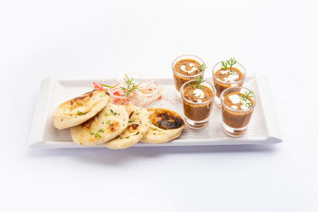 Dal Makhani or dal makhni Shots with Naan kidney beans, butter and cream and served with garlic naan...