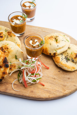 Dal Makhani or dal makhni Shots with Naan kidney beans, butter and cream and served with garlic naan...