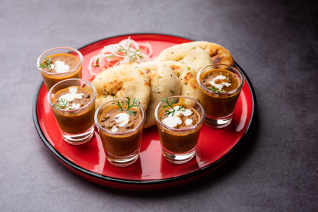 Dal Makhani or dal makhni Shots with Naan kidney beans, butter and cream and served with garlic naan...