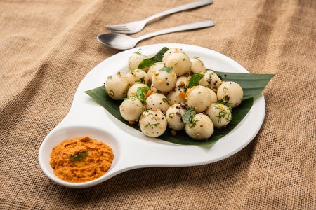 Soft and spongy Idli balls or goli idly with green and red chutney, south indian food recipe