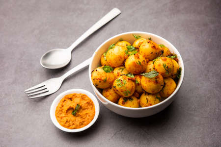 Soft and spongy Idli balls or goli idly with green and red chutney, south indian food recipeの写真素材