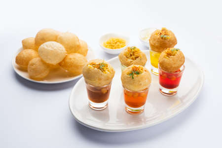Panipuri shot or Golgappa Shots, different flavours of water served in small glasses with stuffed...
