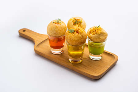 Panipuri shot or Golgappa Shots, different flavours of water served in small glasses with stuffed...