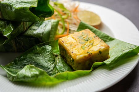 patrani paneer, a paneer marinated in sauce and barbecued and then covered in leafの写真素材