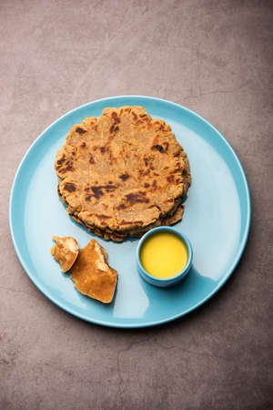 Sweet roti made out of rice flour, jaggery, and ghee. Gud ki roti. gur ki roti, jaggery Bhakri, meethi gud ki roti. Winter food. Copy space.の写真素材