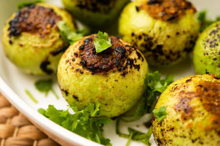 Indian style Tinda or Tinde ki Sabzi also called Indian squash, round melon, Indian round gourd or Indian baby pumpkin, stuffed, stir fried dry or curry recipeの写真素材