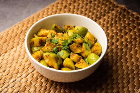 Indian style Tinda or Tinde ki Sabzi also called Indian squash, round melon, Indian round gourd or Indian baby pumpkin, stuffed, stir fried dry or curry recipeの写真素材