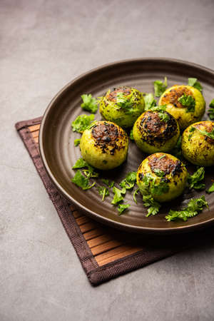 Indian style Tinda or Tinde ki Sabzi also called Indian squash, round melon, Indian round gourd or Indian baby pumpkin, stuffed, stir fried dry or curry recipeの写真素材