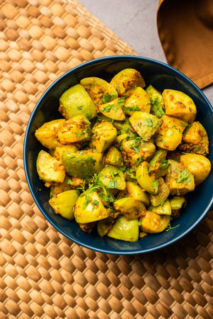 Indian style Tinda or Tinde ki Sabzi also called Indian squash, round melon, Indian round gourd or Indian baby pumpkin, stuffed, stir fried dry or curry recipeの写真素材