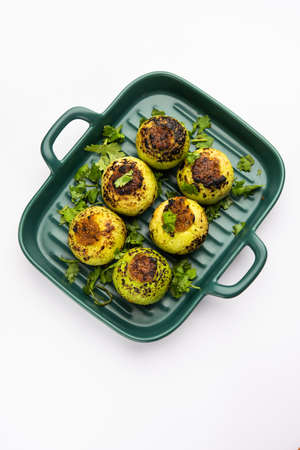 Indian style Tinda or Tinde ki Sabzi also called Indian squash, round melon, Indian round gourd or...