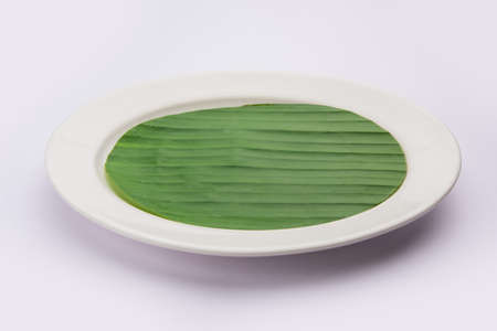 banana leaf on blank plate for edit food or subject onの写真素材