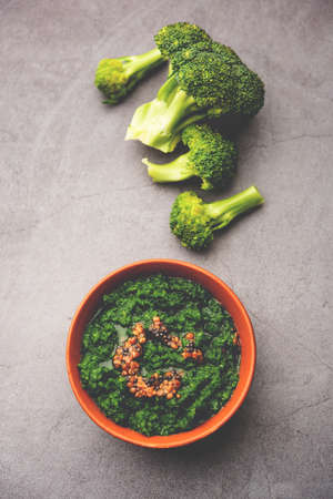 Fresh broccoli chutney or paste, puree in the bowl with raw pieces