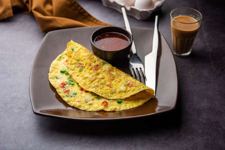 Indian Spiced Masala Omelet filled with fresh vegetable, healthy meal