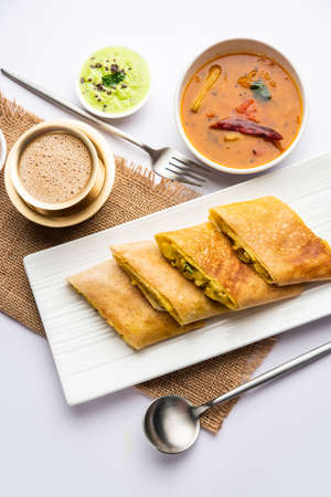 Cut Masala dosa or spring dosa is a South Indian meal served with sambhar and coconut chutney.の写真素材