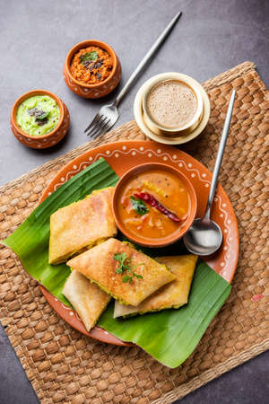 Cut Masala dosa or spring dosa is a South Indian meal served with sambhar and coconut chutney.
