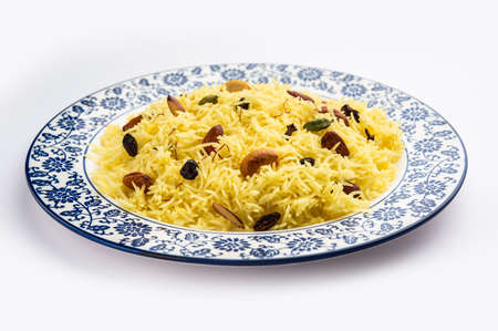 Kashmiri sweet modur pulao made of rice cooked with sugar, water flavored with Saffron and dry fruitsの写真素材