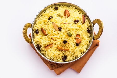 Kashmiri sweet modur pulao made of rice cooked with sugar, water flavored with Saffron and dry fruitsの写真素材
