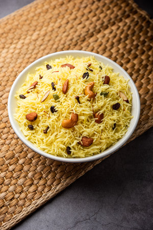 Kashmiri sweet modur pulao made of rice cooked with sugar, water flavored with Saffron and dry fruitsの写真素材