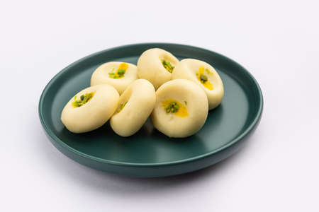 Sandesh or shondesh is a dessert, originating from the Bengal, India, created with milk and sugarの写真素材