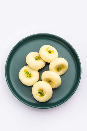 Sandesh or shondesh is a dessert, originating from the Bengal, India, created with milk and sugarの写真素材