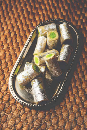 Kaju Pista Roll Or Cashew Pistachio Rolls Mithai or sigar, Indian sweet or dessert for festivalsの写真素材