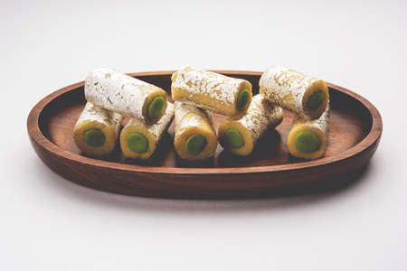 Kaju Pista Roll Or Cashew Pistachio Rolls Mithai or sigar, Indian sweet or dessert for festivalsの写真素材