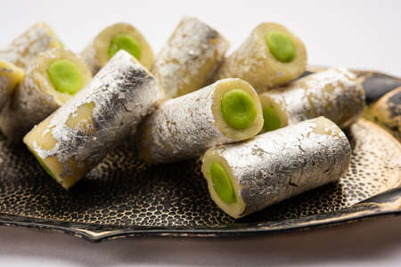 Kaju Pista Roll Or Cashew Pistachio Rolls Mithai or sigar, Indian sweet or dessert for festivalsの写真素材