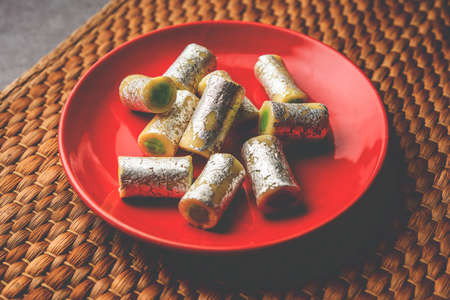 Kaju Pista Roll Or Cashew Pistachio Rolls Mithai or sigar, Indian sweet or dessert for festivalsの写真素材